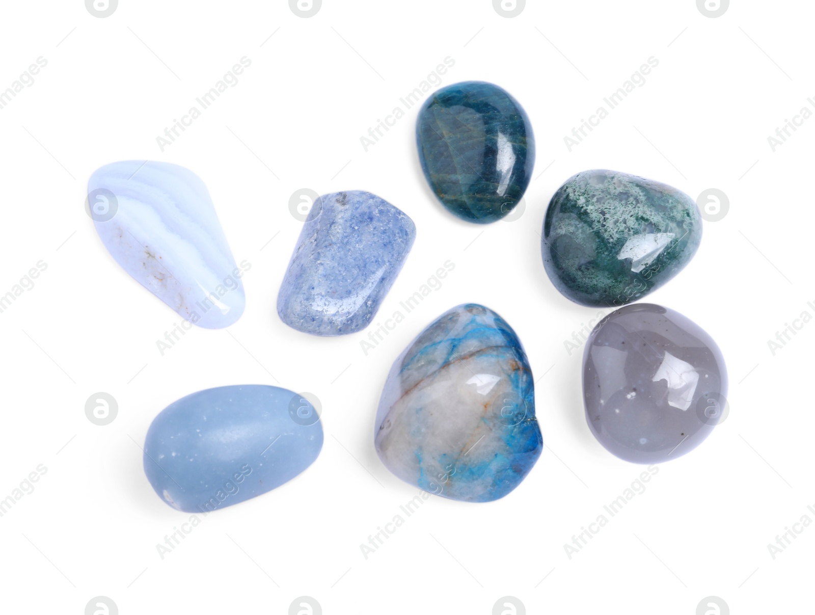 Photo of Many different healing stones isolated on white, top view