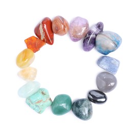Photo of Many different healing stones isolated on white, top view