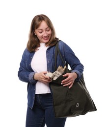 Photo of Recycling. Smiling woman with bag full of different waste paper on white background