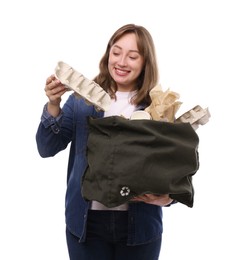 Photo of Recycling. Smiling woman with bag full of different waste paper on white background