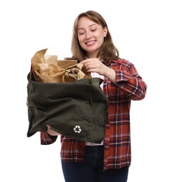 Photo of Recycling. Smiling woman with bag full of different waste paper on white background
