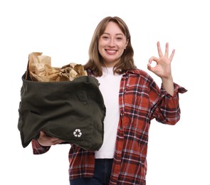Photo of Recycling. Smiling woman with bag full of different waste paper showing OK gesture on white background