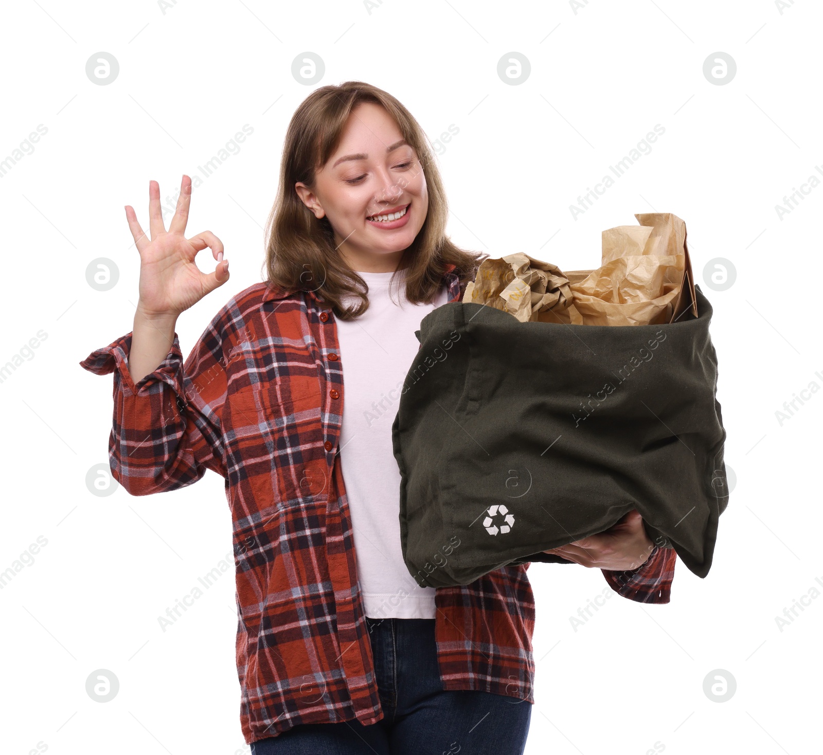 Photo of Recycling. Smiling woman with bag full of different waste paper showing OK gesture on white background
