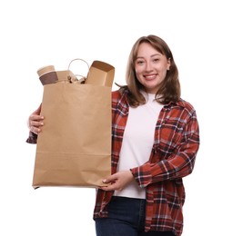 Photo of Recycling. Smiling woman with bag full of different waste paper on white background