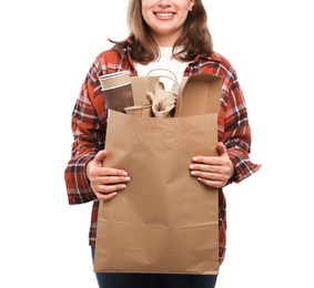 Photo of Recycling. Woman with bag full of different waste paper on white background, closeup