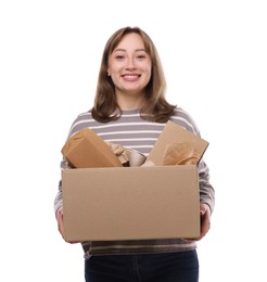 Photo of Recycling. Smiling woman holding cardboard box with different waste paper on white background