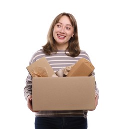 Photo of Recycling. Smiling woman holding cardboard box with different waste paper on white background