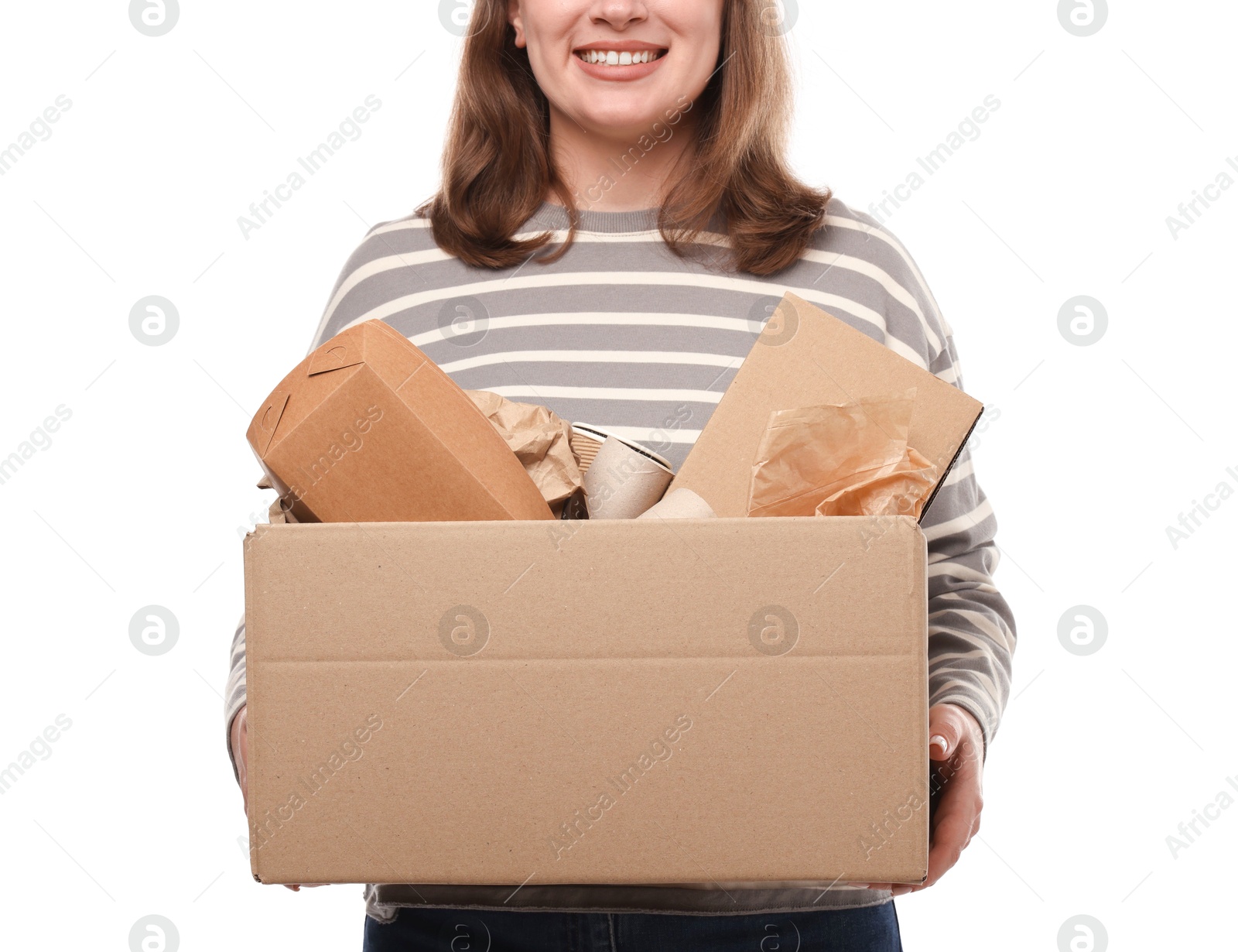 Photo of Recycling. Woman holding cardboard box with different waste paper on white background, closeup