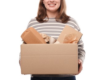 Photo of Recycling. Woman holding cardboard box with different waste paper on white background, closeup