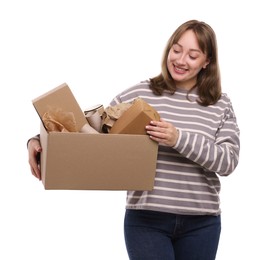 Photo of Recycling. Smiling woman holding cardboard box with different waste paper on white background