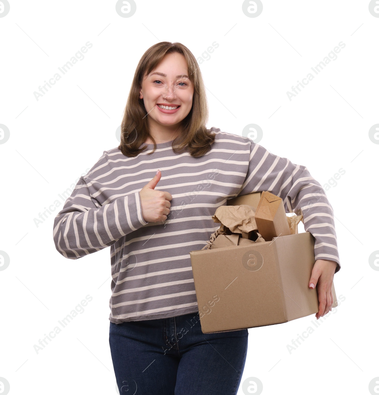 Photo of Recycling. Smiling woman holding cardboard box with different waste paper and showing thumbs up on white background