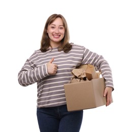 Photo of Recycling. Smiling woman holding cardboard box with different waste paper and showing thumbs up on white background