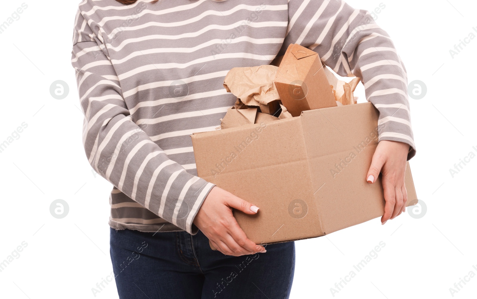 Photo of Recycling. Woman holding cardboard box with different waste paper on white background, closeup
