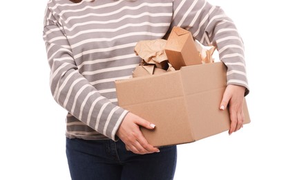 Photo of Recycling. Woman holding cardboard box with different waste paper on white background, closeup