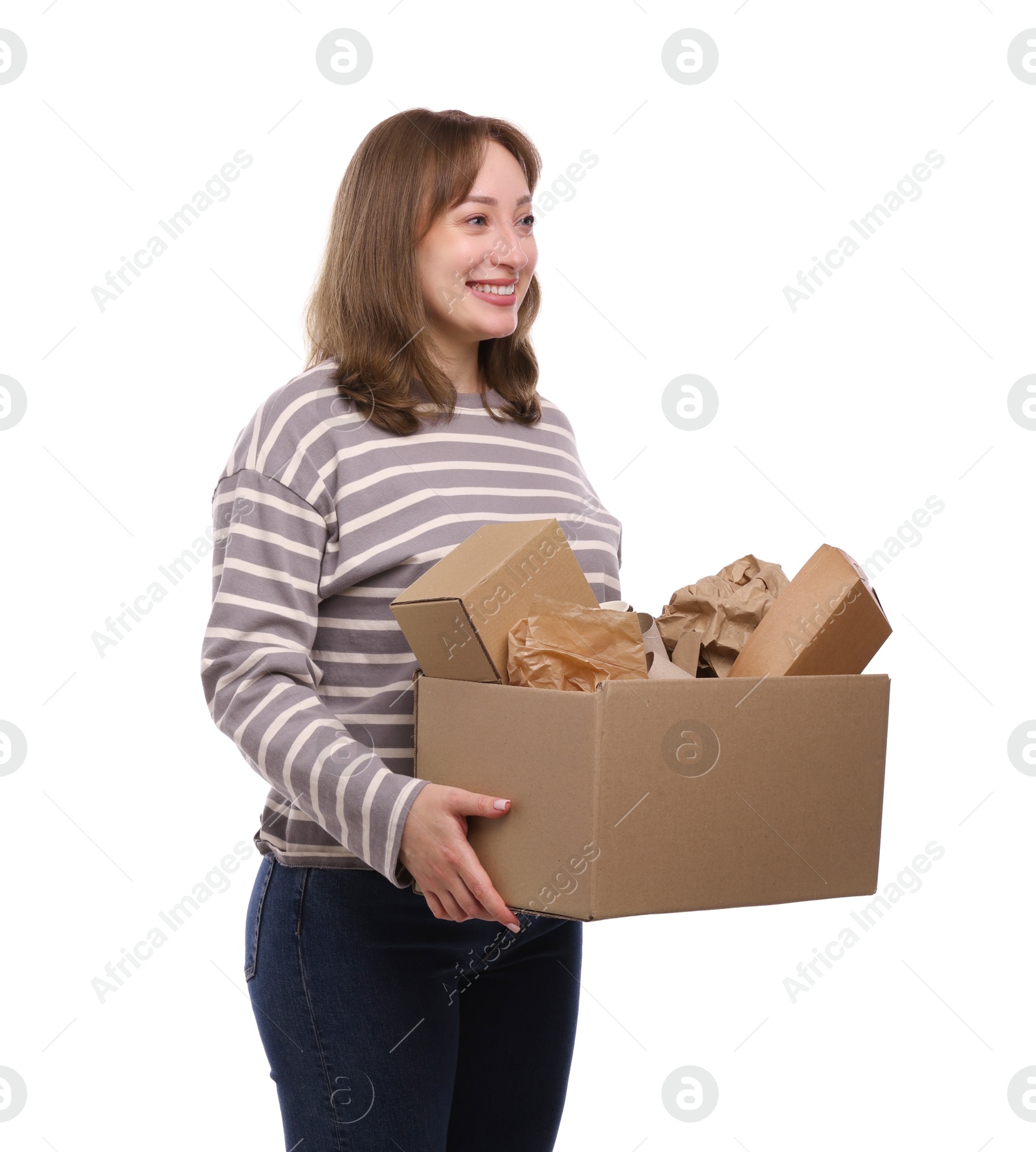 Photo of Recycling. Smiling woman holding cardboard box with different waste paper on white background