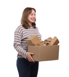 Photo of Recycling. Smiling woman holding cardboard box with different waste paper on white background