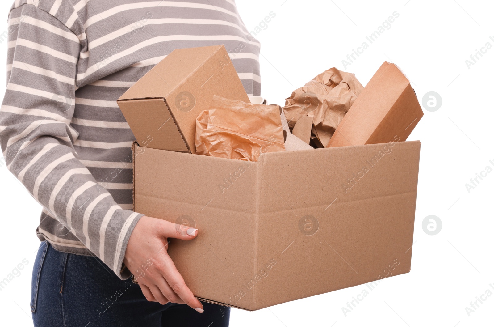 Photo of Recycling. Woman holding cardboard box with different waste paper on white background, closeup