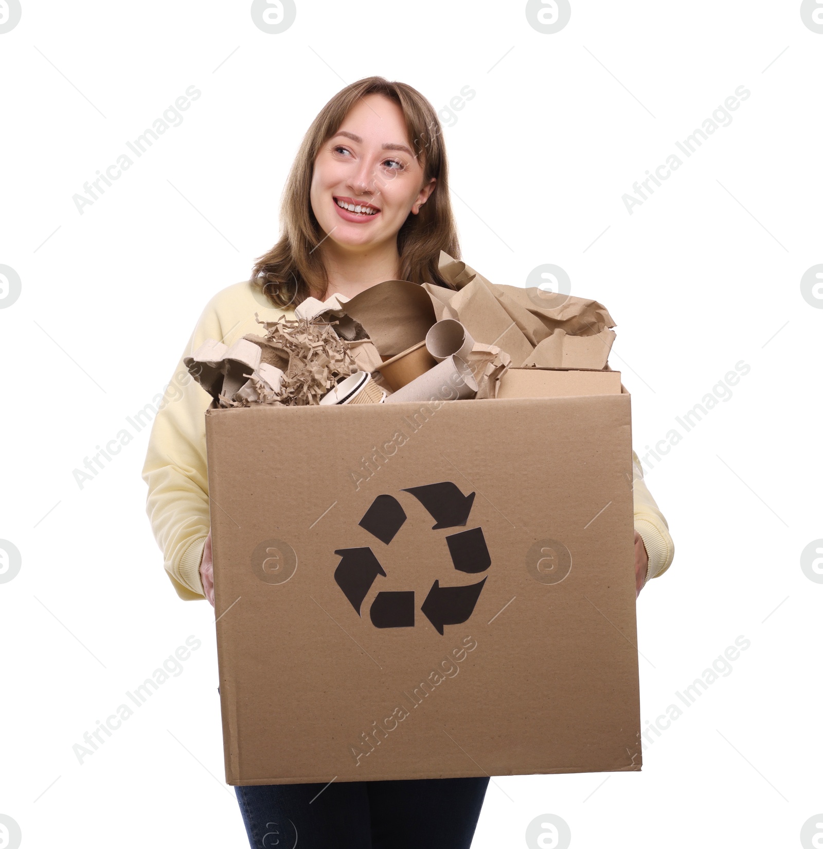 Photo of Recycling. Smiling woman holding cardboard box with different waste paper on white background