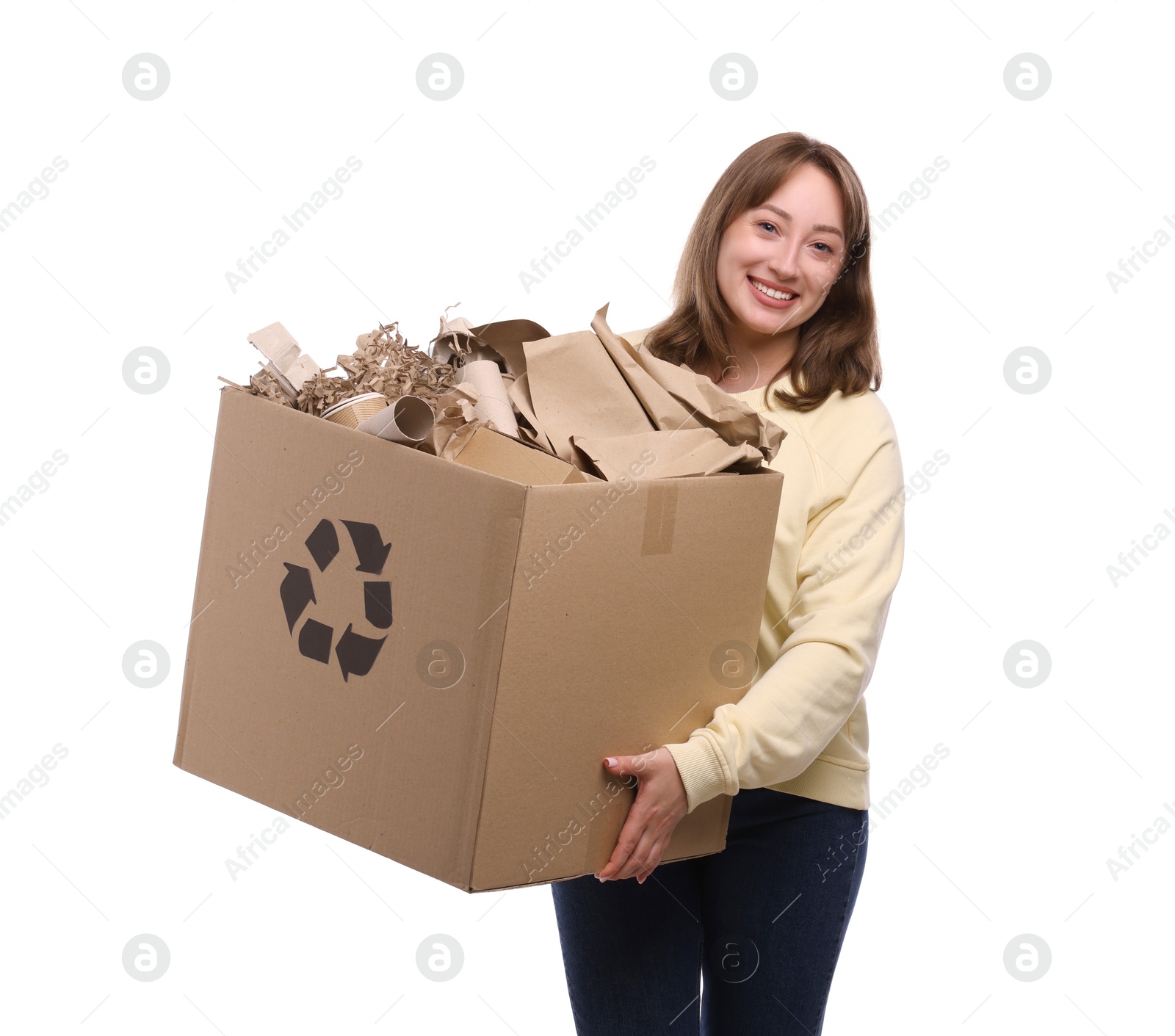 Photo of Recycling. Smiling woman holding cardboard box with different waste paper on white background