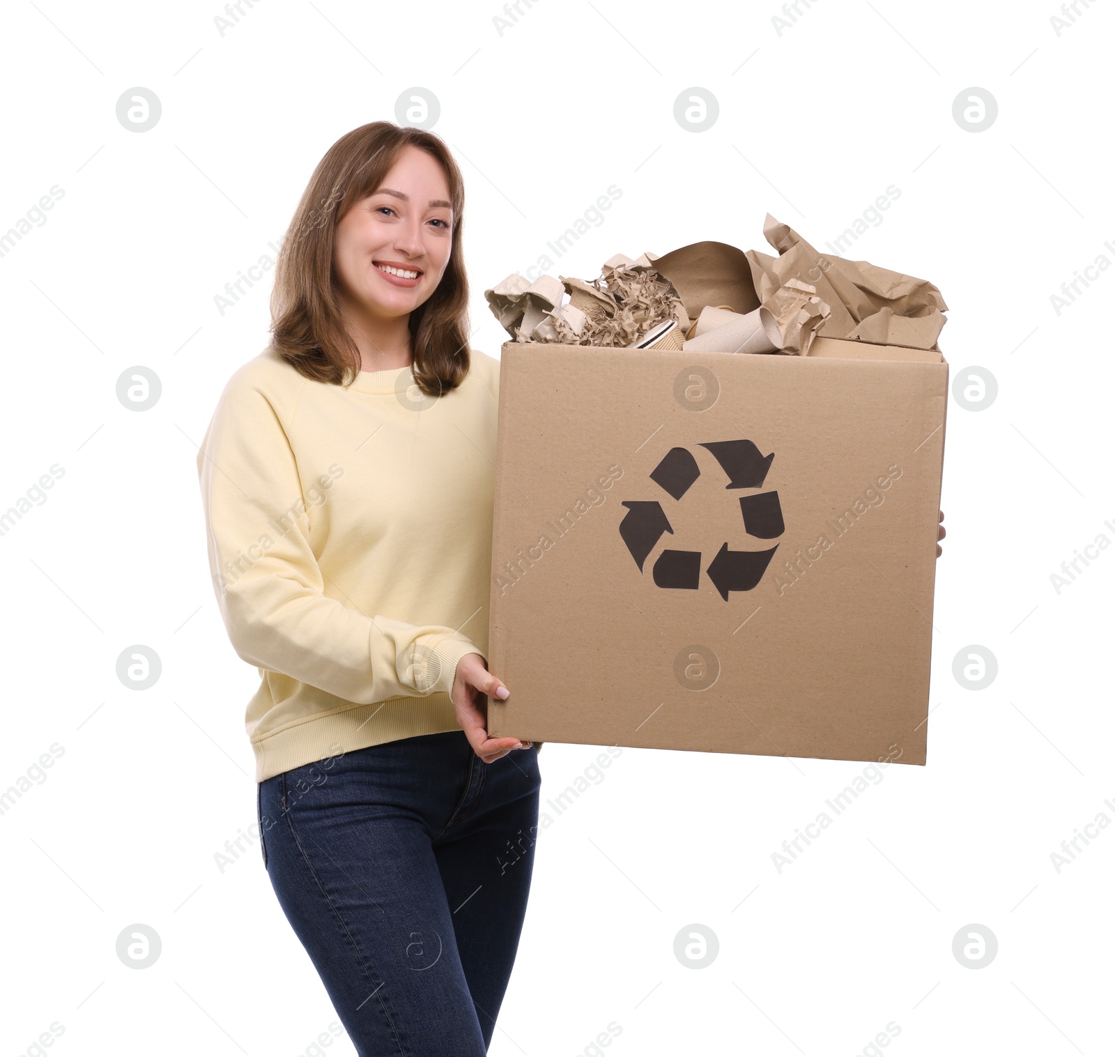 Recycling. Smiling woman holding cardboard box with different waste paper on white background Photo of Recycling. Smiling woman holding cardboard box with different waste paper on white background