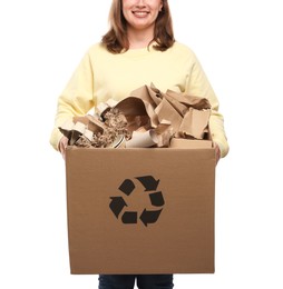 Photo of Recycling. Woman holding cardboard box with different waste paper on white background, closeup