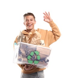Photo of Recycling. Smiling man holding plastic box with different waste paper and showing OK gesture on white background