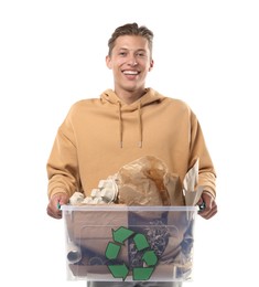 Photo of Recycling. Smiling man holding plastic box with different waste paper on white background