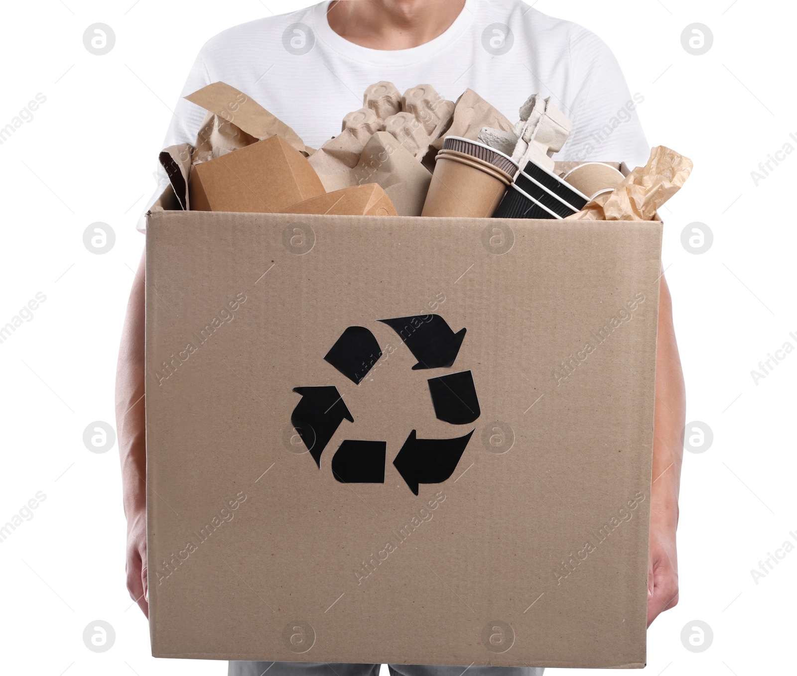 Recycling. Man holding cardboard box with different waste paper on white background, closeup Photo of Recycling. Man holding cardboard box with different waste paper on white background, closeup
