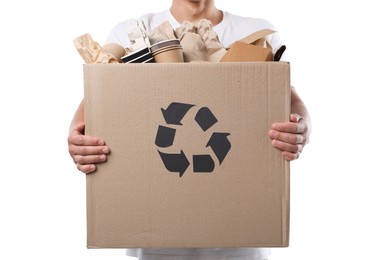 Photo of Recycling. Man holding cardboard box with different waste paper on white background, closeup