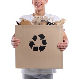 Photo of Recycling. Man holding cardboard box with different waste paper on white background, closeup