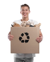 Photo of Recycling. Smiling man holding cardboard box with different waste paper on white background