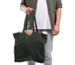 Photo of Recycling. Man with bag full of different waste paper on white background, closeup