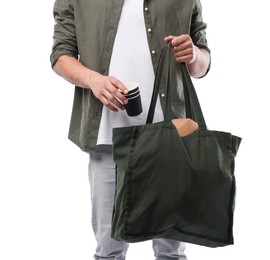 Photo of Recycling. Man with bag full of different waste paper on white background, closeup