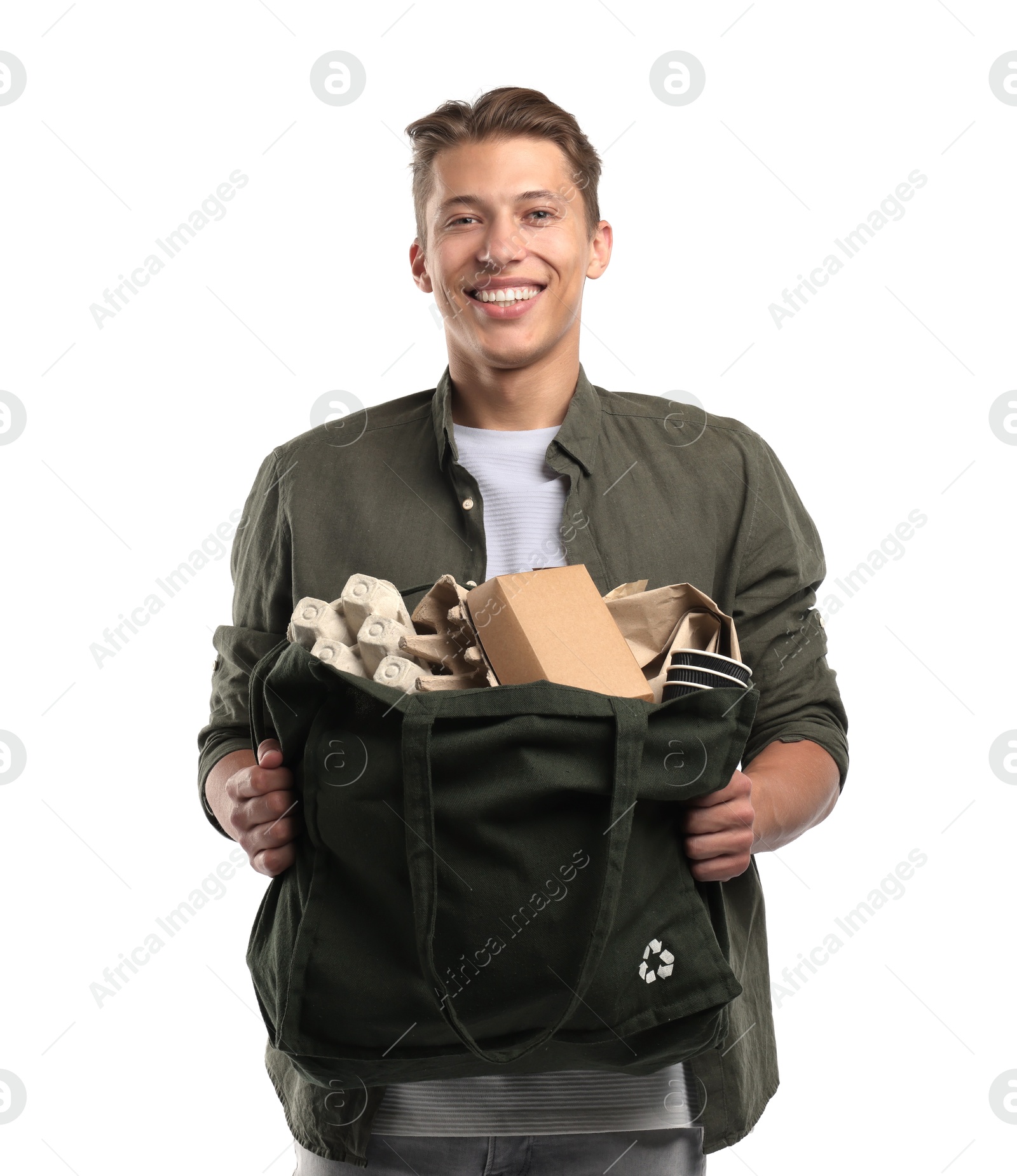 Recycling. Smiling man with bag full of different waste paper on white background Photo of Recycling. Smiling man with bag full of different waste paper on white background