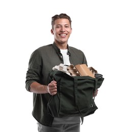 Photo of Recycling. Smiling man with bag full of different waste paper on white background