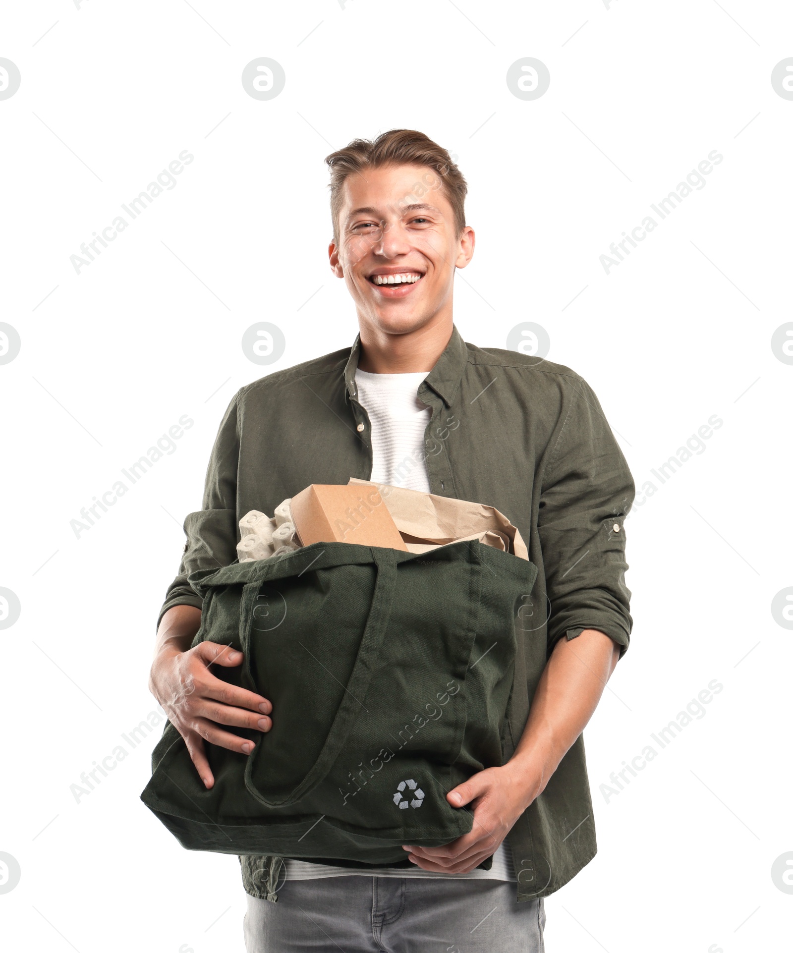Recycling. Smiling man with bag full of different waste paper on white background Photo of Recycling. Smiling man with bag full of different waste paper on white background