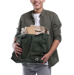 Photo of Recycling. Man with bag full of different waste paper on white background, closeup