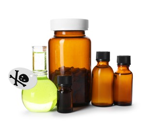 Photo of Bottles of poisons with warning sign isolated on white