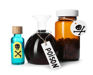 Photo of Bottles of poisons with warning signs isolated on white