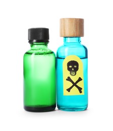 Photo of Bottles of poisons with warning sign isolated on white