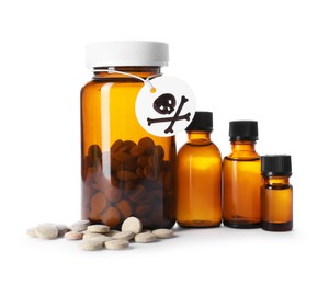 Photo of Bottles of poisons with warning sign isolated on white