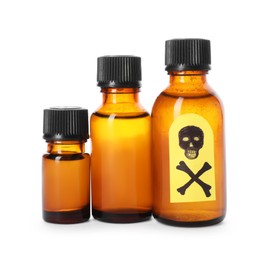 Photo of Bottles of poisons with warning sign isolated on white