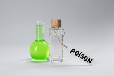 Photo of Bottles of poisons on light grey background