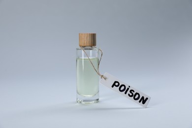Photo of Bottle with poison on light grey background