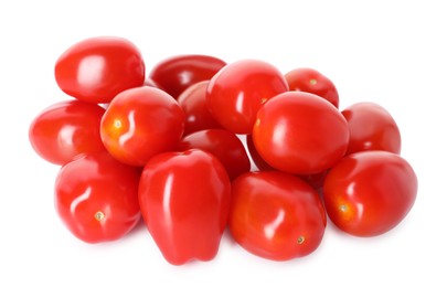 Photo of Many ripe red tomatoes isolated on white