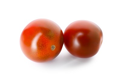 Photo of Two ripe juicy tomatoes isolated on white