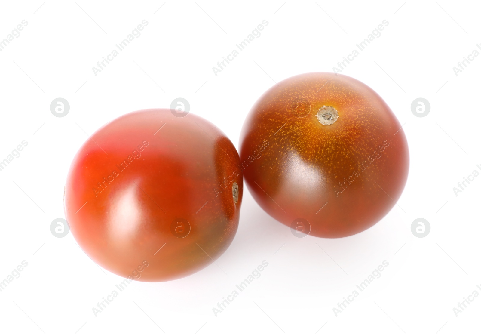Photo of Two ripe juicy tomatoes isolated on white
