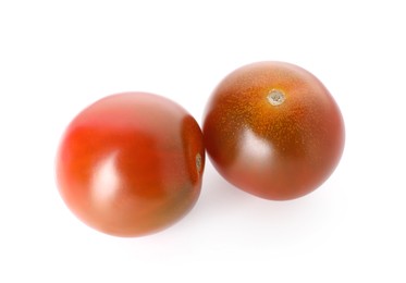 Photo of Two ripe juicy tomatoes isolated on white