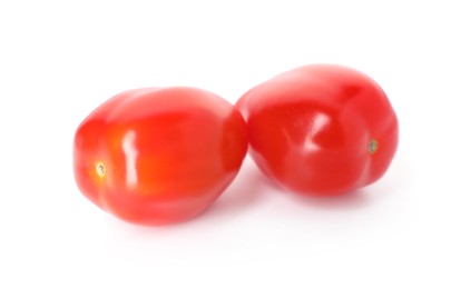 Photo of Two ripe red tomatoes isolated on white