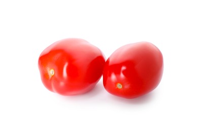 Photo of Two ripe red tomatoes isolated on white